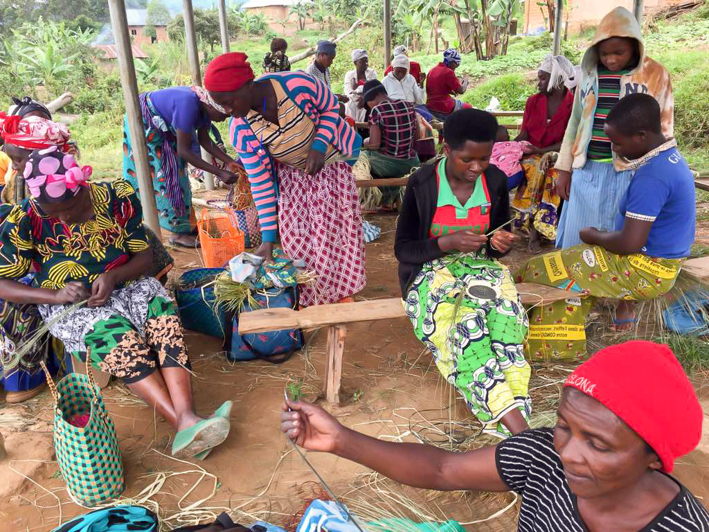 Batwa Refugee Women Weaving Baskets