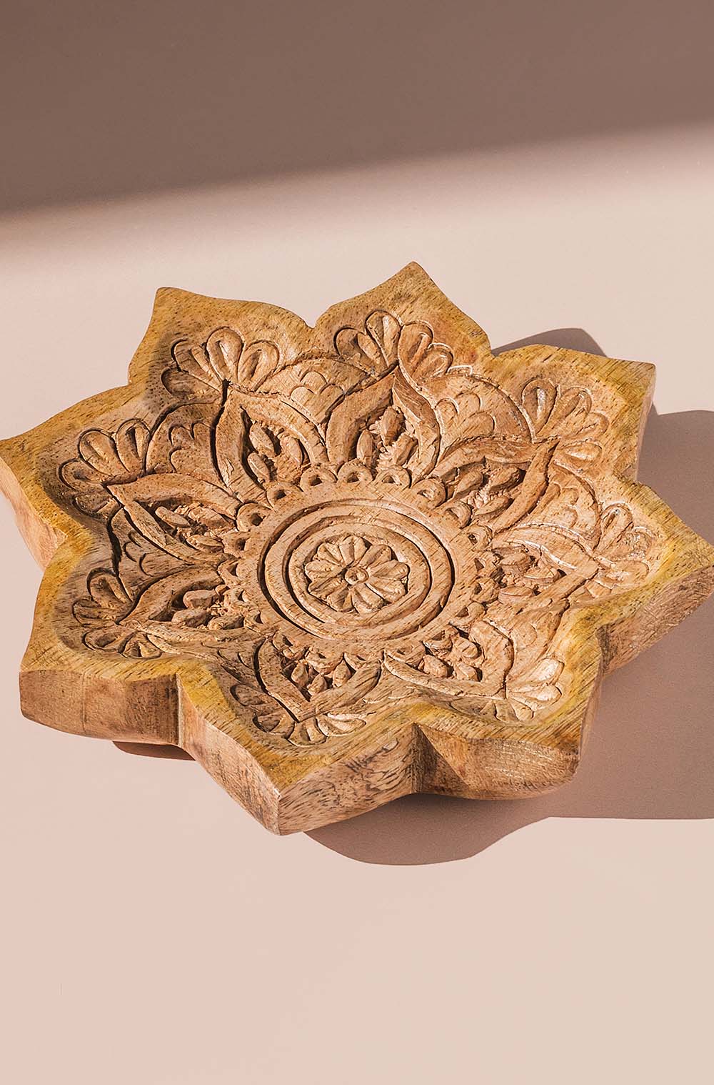 one mandala wooden dish that is ethically made by trades of hope fair trade artisan partners in India 